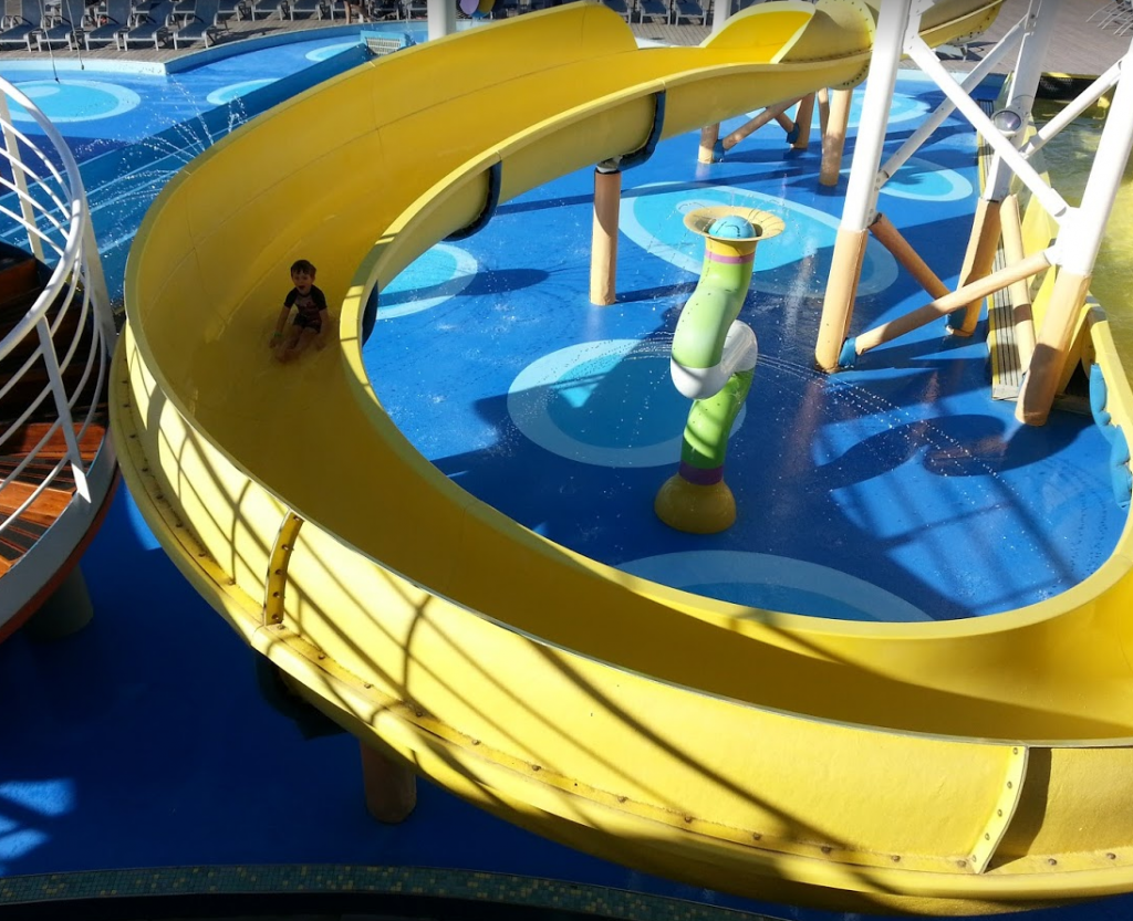 Kids enjoying the water slide on a Disney cruise ship.