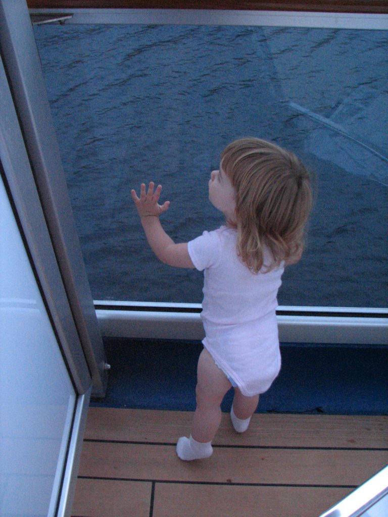 Toddler Looking out Cruise Ship Balcony