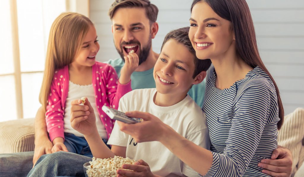 Family at home enjoying movie time together