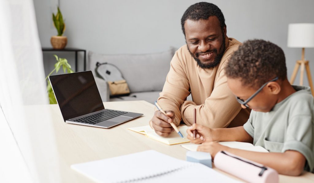 Little  Boy Studying with Father at Home